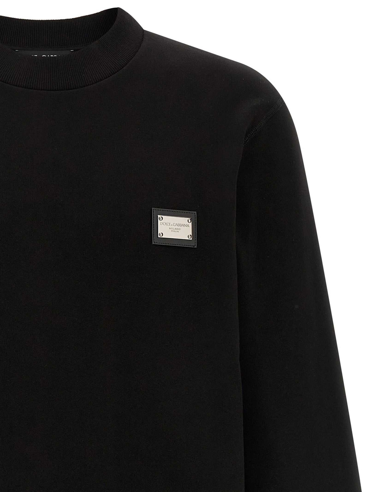 Dolce & Gabbana schwarzer Baumwoll-Sweatshirt mit Lederpatch und Logo-Tag