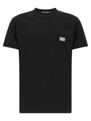 Dolce & Gabbana schwarzes Baumwoll-Jersey-T-Shirt mit Lederpatch und metallischem Logo-Tag