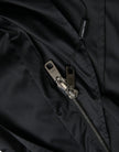 Dolce & Gabbana Schwarze lange Windbreaker-Jacke mit Kapuze aus Polyester
